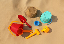Set Of Plastic Beach Toys On Sand. Outdoor Play