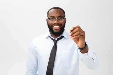 Young African american business man writing something on glass board with a marker