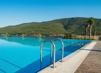 Poster - Nice swimming pool outdoors on bright summer day