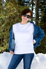 Wall Mural - White sweatshirt mockup of a woman in sunglasses, model mockup