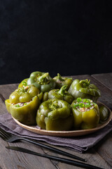 Wall Mural - Green bell peppers stuffed with meat, rice and vegetables. Tasty food. 