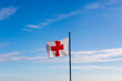 white flag with red cross