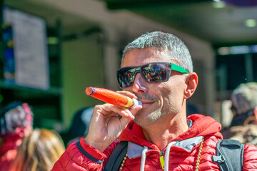 Sticker - Happy smiling man pretending to smoke cigar in Mardi Gras Carnival Parade, New Orleans.