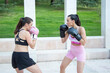 © luisrojasstock - two young caucasian women boxers practicing boxing fight