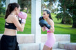 © luisrojasstock - two young caucasian women boxers practicing boxing fight