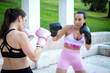 © luisrojasstock - two young caucasian women boxers practicing boxing