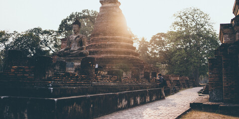 Wall Mural - old buddha temple in Sukhothai Province of Thailand, Thai temple is a landmark Asian travel tourism