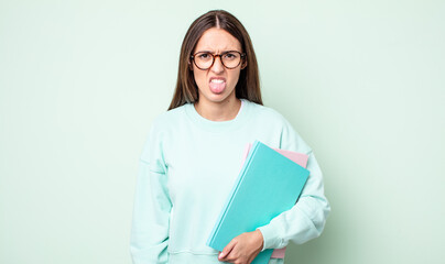 Poster - young pretty woman feeling disgusted and irritated and tongue out. universitary student