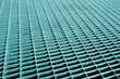 Metal grid pattern with blur effect in cyan tone.