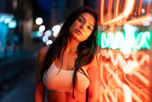 Attractive Woman Near Illuminated Building