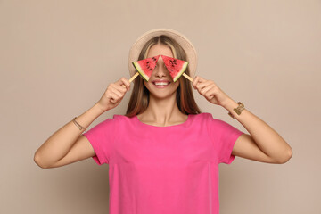 Poster - Beautiful girl with pieces of watermelon on beige background