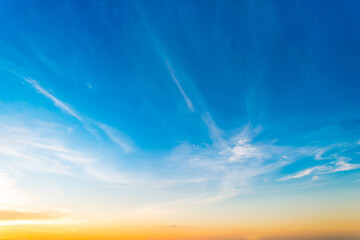 Wall Mural - Colorful Sky blue and orange light of the sun through the clouds in the sky