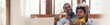African American Father playing airplane toys with his little boy. Banner and panoramic web with copy space.