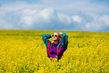 Sticker - Beautiful woman in vintage tracksuit in yellow rapeseed field