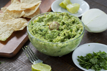 Wall Mural - Closeup shot of tortilla chips with guacamole dip