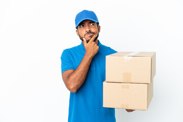 Poster - Delivery Ecuadorian man isolated on white background having doubts