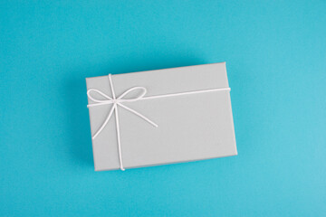 Gift box isolated on a blue background, copy space, fathers day, birthday, valentine present