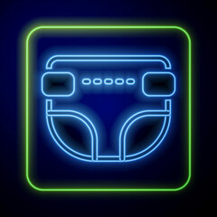 Poster - Glowing neon Adult diaper icon isolated on blue background. Vector