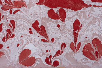 Abstract texture of white color smudges on a red background