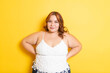 © cesar - Plus size redhead young woman modeling with smile. overweight model