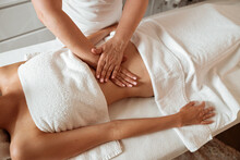 Young Woman Receiving Abdominal Massage In Spa Salon