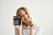 © SHOTPRIME STUDIO - Businesswoman calculator in hand and bitcoin light background