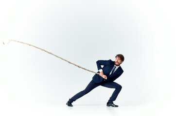 Poster - a man in a suit pulling a rope office manager teamwork