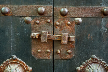 antique wooden closet with metal handle 