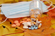 © Oleg - Pills and protective face masks on autumn maple leaves. Concept of nutrition supplements, vitamins for immunity in flu season and coronavirus pandemic