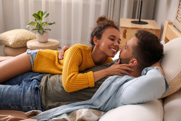 Wall Mural - Lovely couple enjoying each other on bed at home