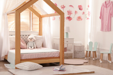 Sticker - Stylish child room interior with wooden house bed