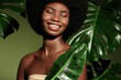 © Beauty Agent Studio - Organic cosmetics concept.  Beauty portrait of young beautiful african american woman with posing with banana leaf curly hair against green exotixc plants background.