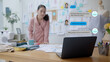 © ChayTee - Busy asia woman fashion designer people use smart future tech ai e-commerce CRM chat bot app on notebook to help support talk or text answer customer ask data on web page for SME B2C retail sell IOT.