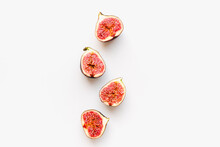 Figs On A White Background. Fig Halves. Sliced Figs.