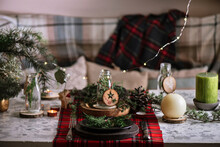 Christmas Table Setting With A Pine Wreath In The Plate