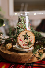 Christmas Table Setting With Wreath And Wooden Ornaments