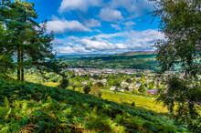 A Tree Framed View From Ilkley Moor Above The Town Of Ilkley Yorkshire, UK In Summertime
