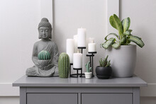 Stylish Decor With Houseplants On Grey Table Near Light Wall. Interior Accessories