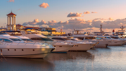 Wall Mural - modern expensive boats are moored at the dock of the seaport in the Russian resort town of Sochi