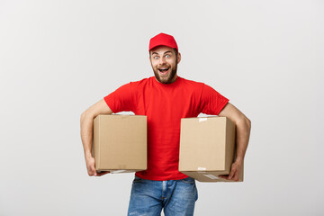 Wall Mural - Portrait delivery man in cap with red t-shirt working as courier or dealer holding two empty cardboard boxes. Receiving package. Copy space for advertisement