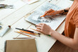 canvas print picture - Young female artist drawing in workshop