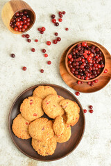 Wall Mural - Composition with tasty cranberry cookies and berries on light background