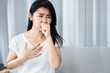 Asian woman having morning sickness feeling nausea and want to vomit