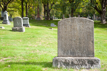 Large blank tombstone in cemetery 