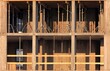Frame and sections of a new monolithic multi-storey building. Monolithic floor formwork and supports. Telescopic concrete floor props. Construction of a modern apartment building