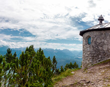 Beautiful Alpine View With A Chapel At The Mountain Summit Fahrenberg Near The Famous Place Herzogstand And Lake Walchensee. Bavaria, Bavarian Prealps Germany