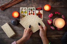 Fortune Teller Reading A Future By Tarot Cards On Rustic Table	