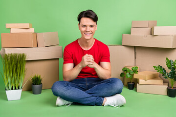 Canvas Print - Full length photo of young guy happy smile carton box move relocation property isolated over green color background