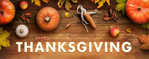 Sticker - a thanksgiving autumn harvest background of pumpkins, pears, leaves and corncobs on a rustic wooden 