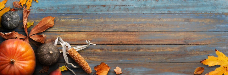 Sticker - a thanksgiving autumn harvest background of pumpkins, pears, leaves and corncobs on a rustic wooden 